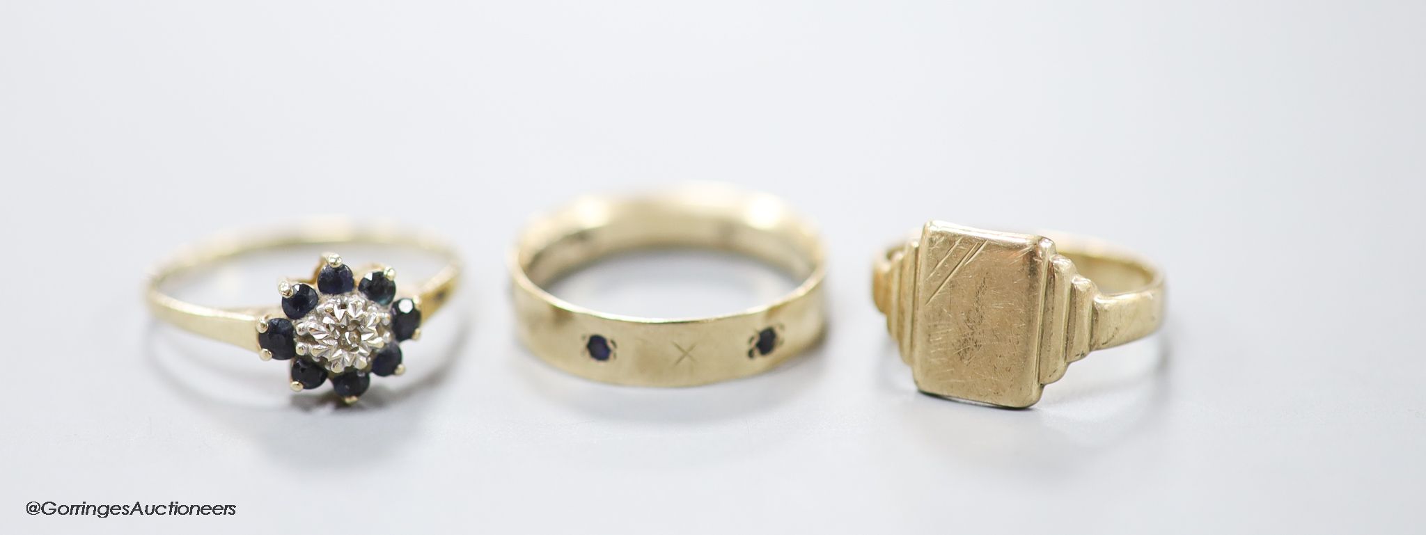 Three assorted modern 9ct gold rings including signet and gem set